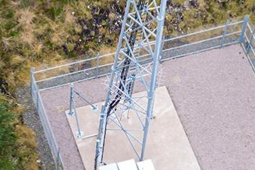 Aerial view of a tall communications tower.