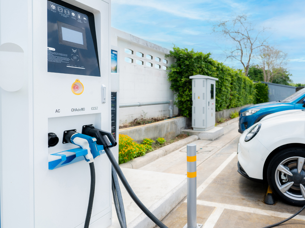 Electric vehicle charging station with cords.