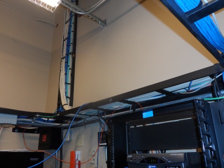 Network cables in server room rack.