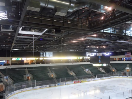 Empty hockey arena with seats and lights